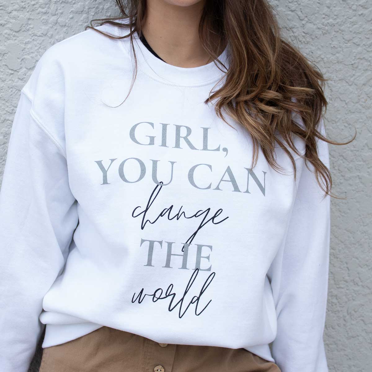 Sweatshirt for sale that reads "Girl, you can change the world"